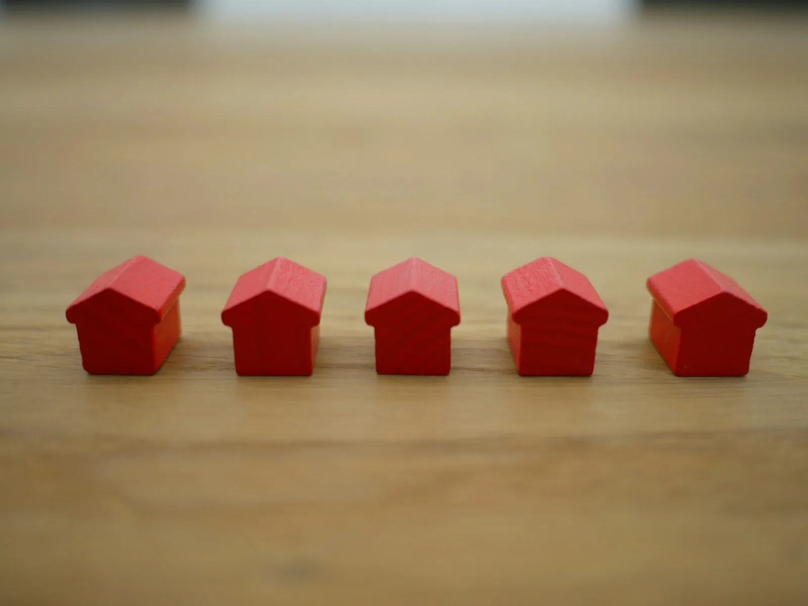 Professional reviewing property listings on a modern workspace